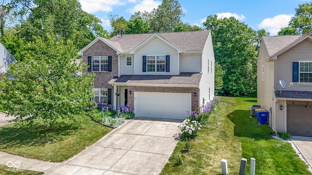 5145 Greenside Dr, Indianapolis, IN 46235 - traditional home featuring a garage, concrete driveway, a front lawn, and brick siding