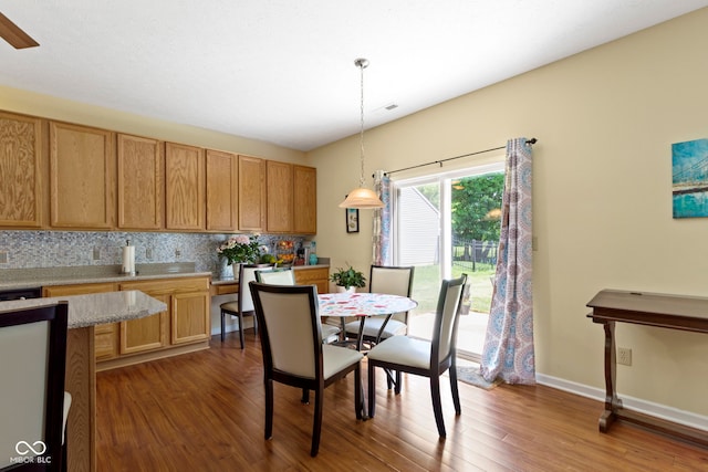 5145 Greenside Dr, Indianapolis, IN 46235 - dining room featuring dark wood-style flooring and baseboards