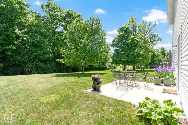5145 Greenside Dr, Indianapolis, IN 46235 - view of grassy yard featuring a patio area