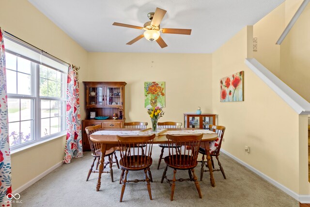 5145 Greenside Dr, Indianapolis, IN 46235 - dining area with a ceiling fan, baseboards, and light colored carpet