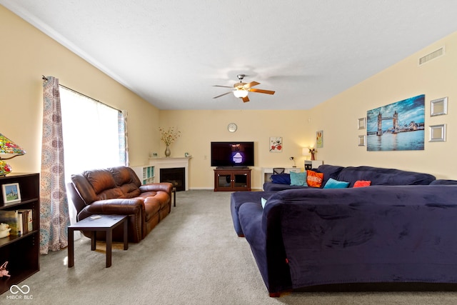 5145 Greenside Dr, Indianapolis, IN 46235 - living area with carpet floors, ceiling fan, and a fireplace