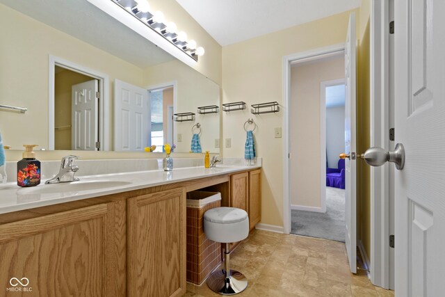 5145 Greenside Dr, Indianapolis, IN 46235 - full bathroom with double vanity and baseboards