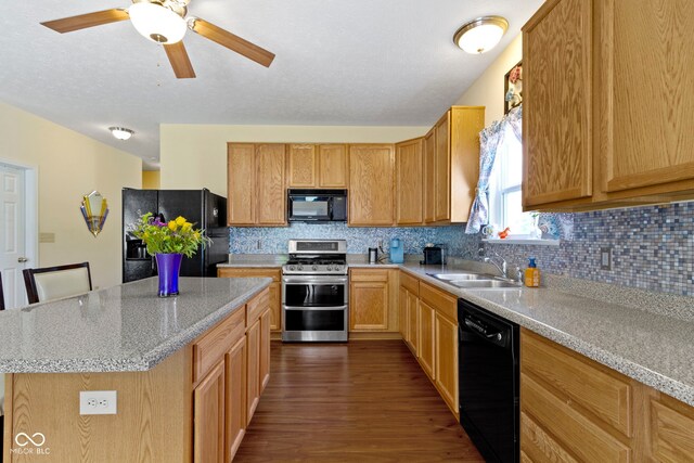 5145 Greenside Dr, Indianapolis, IN 46235 - kitchen featuring black appliances, a sink, dark wood-style floors, tasteful backsplash, and a kitchen island