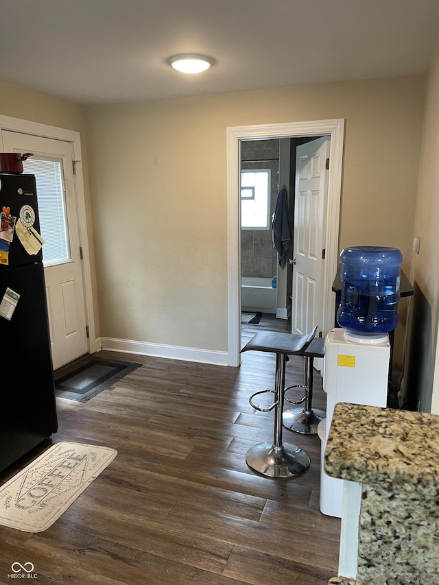 1931 E 68th St, Indianapolis, IN 46220 - foyer with dark wood-style flooring and baseboards
