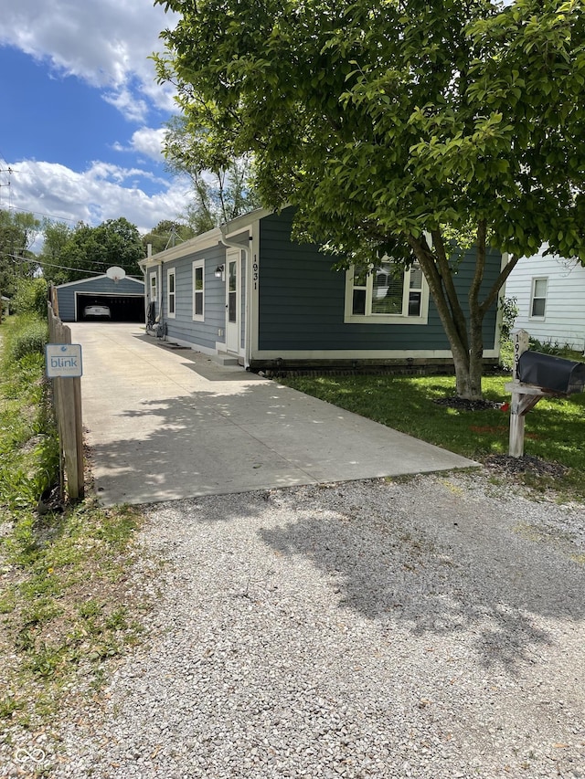 1931 E 68th St, Indianapolis, IN 46220 - view of front facade with an outbuilding and driveway