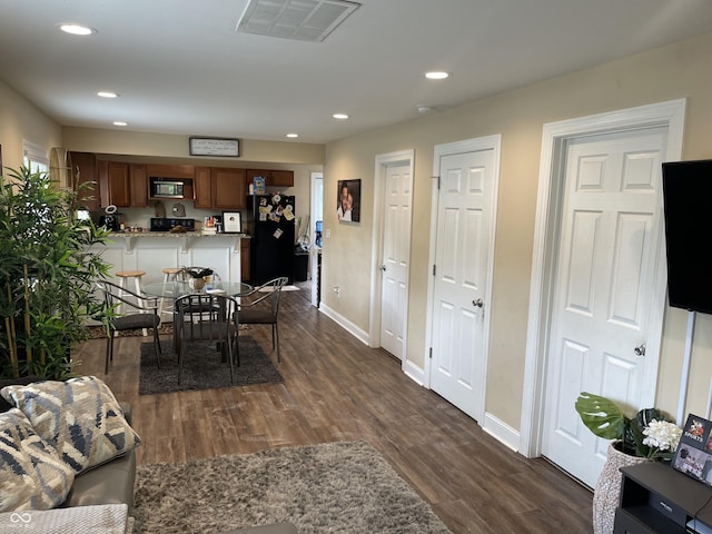 1931 E 68th St, Indianapolis, IN 46220 - dining space with dark wood-style floors, recessed lighting, and baseboards
