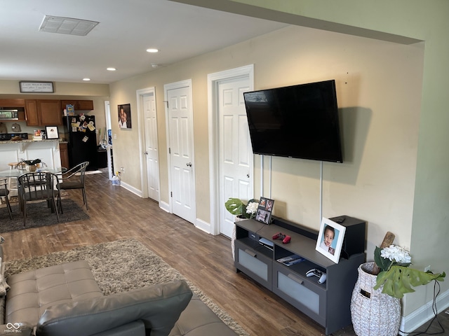1931 E 68th St, Indianapolis, IN 46220 - living area with dark wood-type flooring, baseboards, and recessed lighting