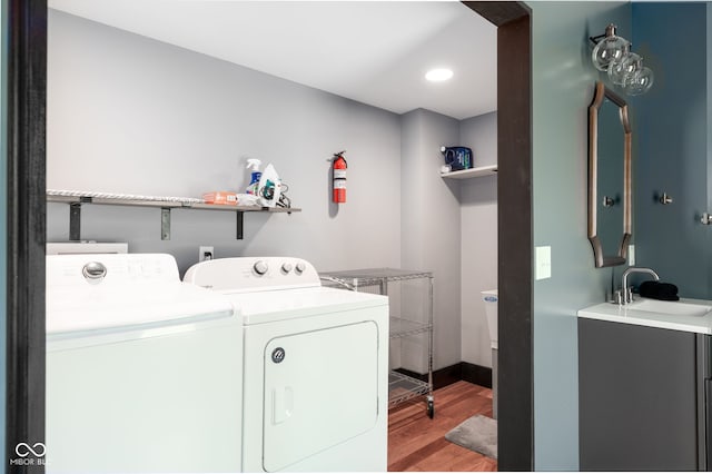 2215 S Delaware St, Indianapolis, IN 46225 - laundry room with washing machine and dryer, light wood-type flooring, and recessed lighting