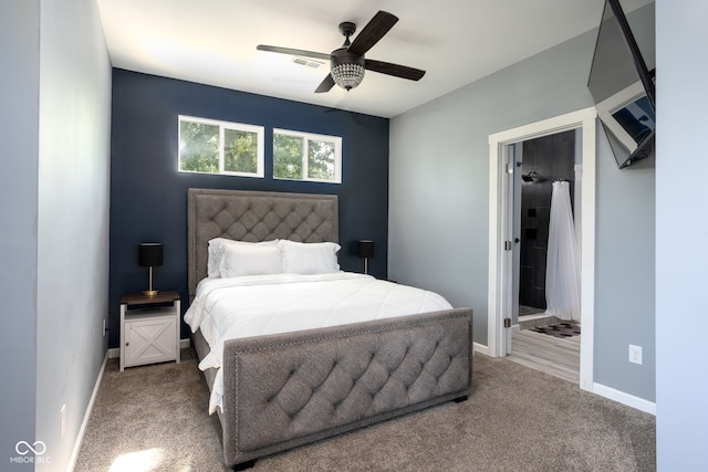 2215 S Delaware St, Indianapolis, IN 46225 - carpeted bedroom with baseboards, ensuite bathroom, and ceiling fan