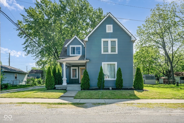 2215 S Delaware St, Indianapolis, IN 46225 - traditional home with a front lawn and roof with shingles