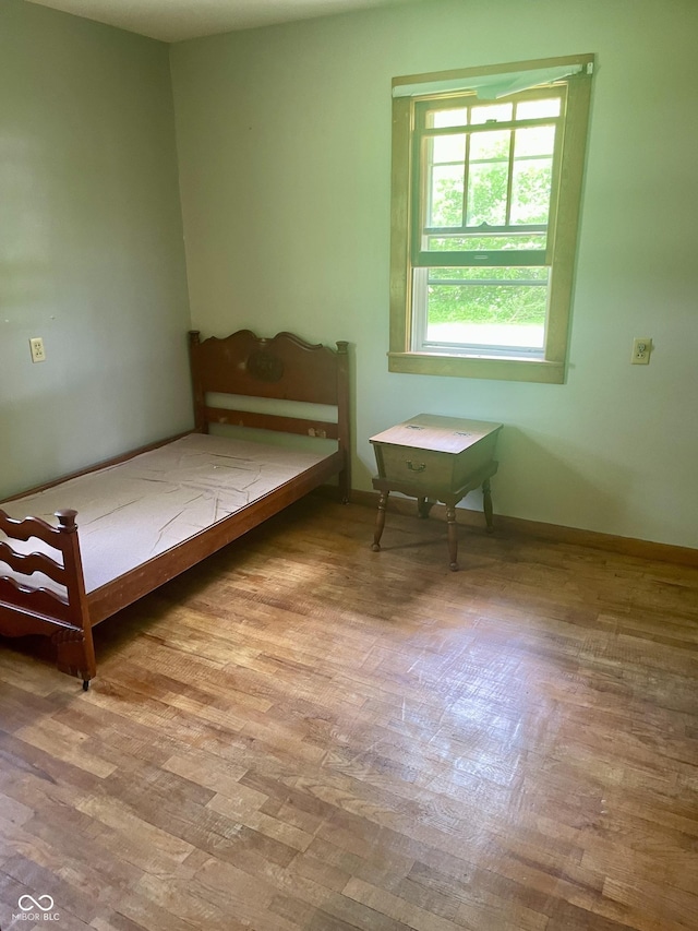 bedroom featuring wood finished floors