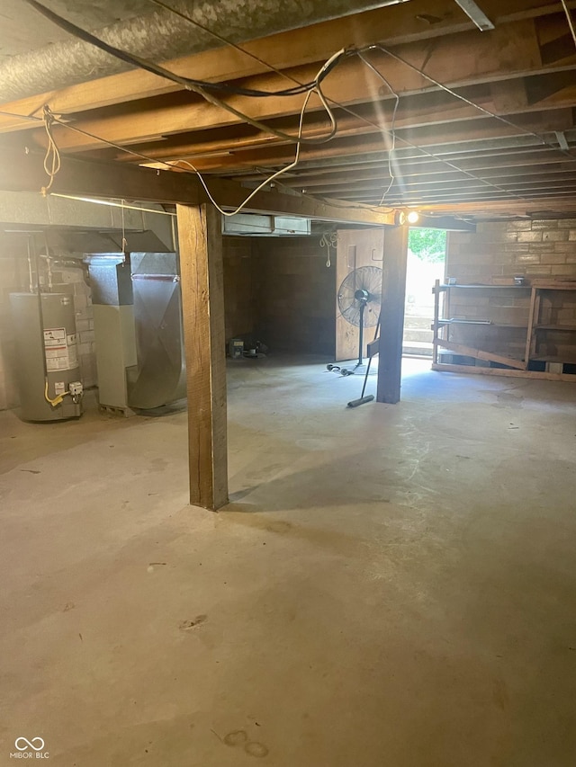 basement with water heater and heating unit