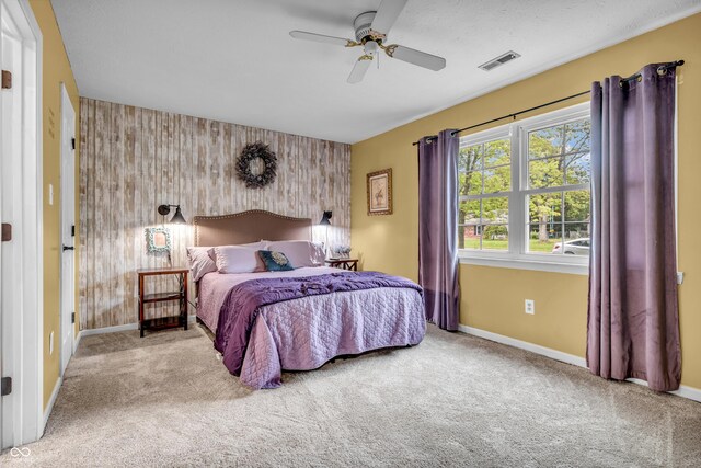1104 Briarwood Dr, Brownsburg, IN 46112 - bedroom featuring an accent wall, carpet floors, baseboards, ceiling fan, and wallpapered walls