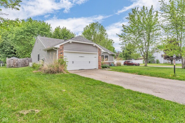 1104 Briarwood Dr, Brownsburg, IN 46112 - ranch-style home featuring a garage, driveway, and brick siding