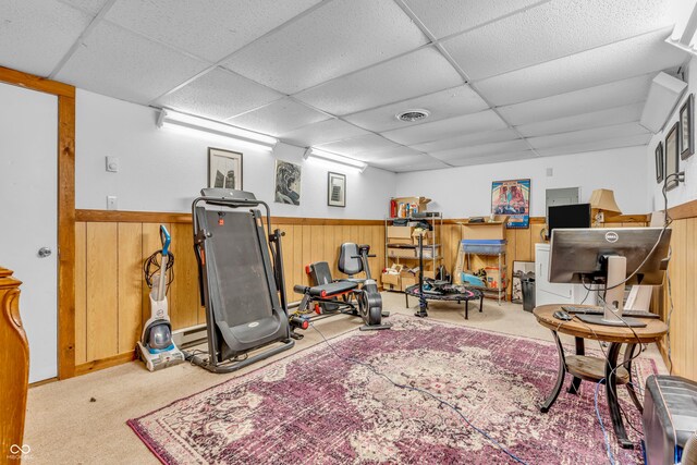 1104 Briarwood Dr, Brownsburg, IN 46112 - workout room with a paneled ceiling, wainscoting, carpet flooring, and wooden walls