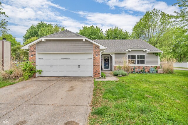 1104 Briarwood Dr, Brownsburg, IN 46112 - single story home featuring brick siding, a garage, a front lawn, driveway, and a shingled roof