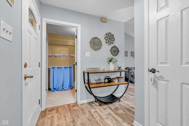 1104 Briarwood Dr, Brownsburg, IN 46112 - hallway featuring light wood-style flooring and baseboards