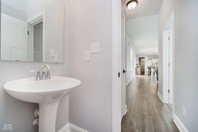 7077 Antiquity Dr, Carmel, IN 46033 - bathroom with wood finished floors and baseboards