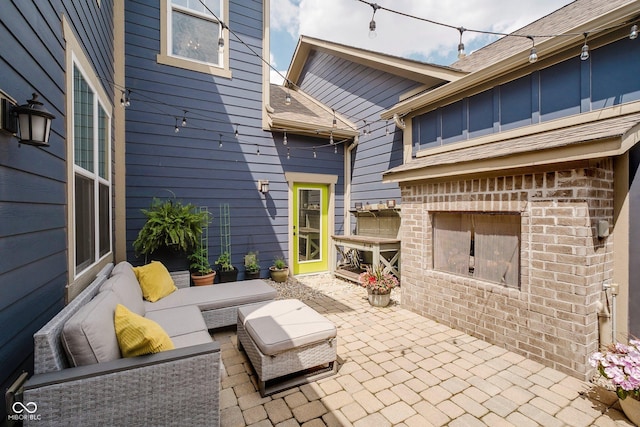 7077 Antiquity Dr, Carmel, IN 46033 - view of patio / terrace with an outdoor living space with a fireplace