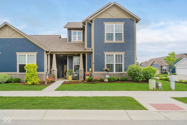 7077 Antiquity Dr, Carmel, IN 46033 - craftsman-style home featuring a front yard, board and batten siding, roof with shingles, and brick siding