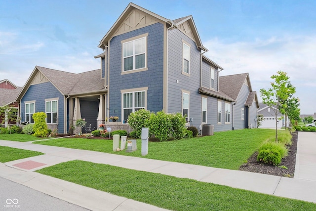 7077 Antiquity Dr, Carmel, IN 46033 - view of front facade with a front lawn, cooling unit, and board and batten siding