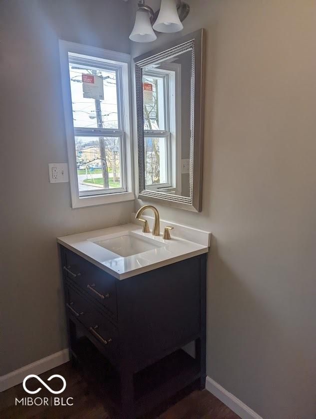 2968 N Arsenal Ave, Indianapolis, IN 46218 - bathroom with vanity and baseboards