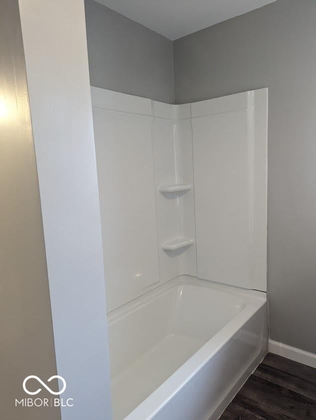 2968 N Arsenal Ave, Indianapolis, IN 46218 - full bath with wood finished floors, baseboards, a shower, and a bath