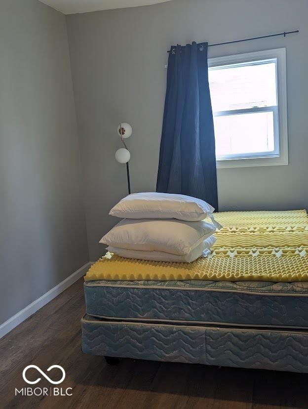 2968 N Arsenal Ave, Indianapolis, IN 46218 - bedroom with wood finished floors and baseboards
