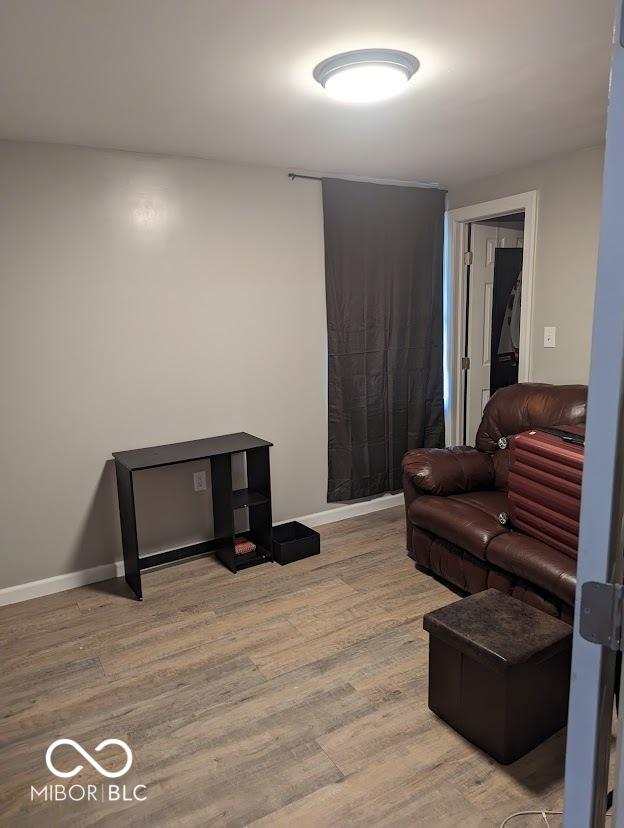 2968 N Arsenal Ave, Indianapolis, IN 46218 - living room with wood finished floors and baseboards