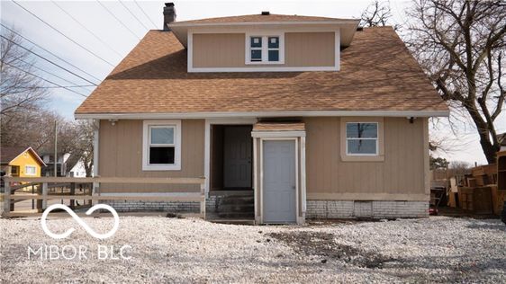 2968 N Arsenal Ave, Indianapolis, IN 46218 - rear view of property featuring a chimney and a shingled roof