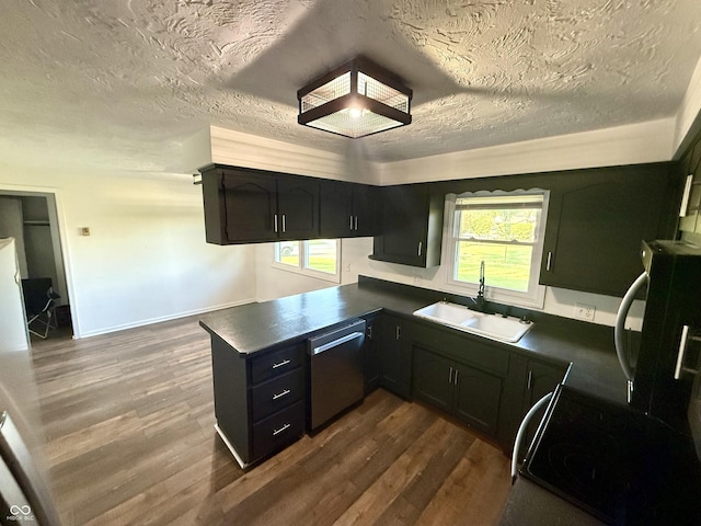 1328 N 300 E, Anderson, IN 46012 - kitchen featuring dishwasher, a sink, dark countertops, a peninsula, and dark wood finished floors