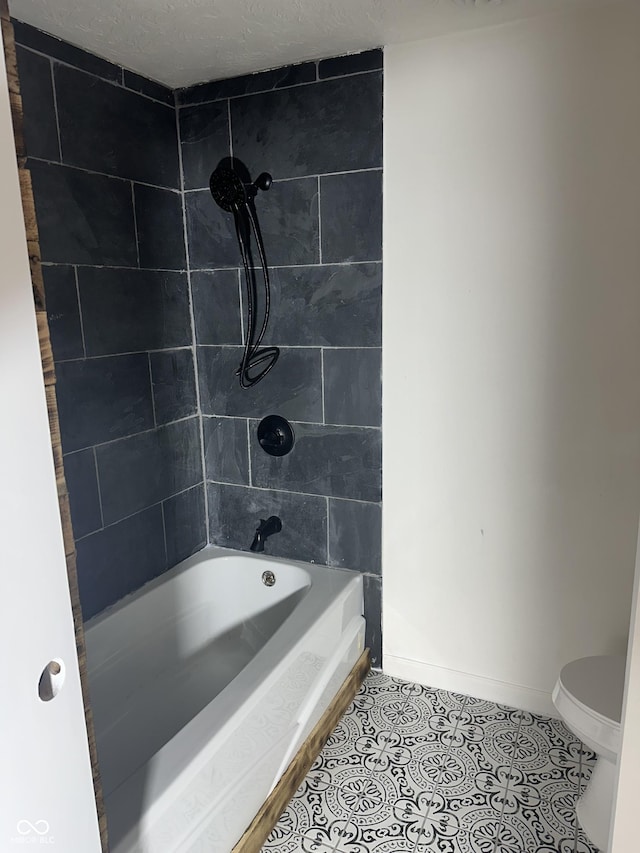 1328 N 300 E, Anderson, IN 46012 - full bathroom featuring tile patterned flooring, toilet, baseboards, and tub / shower combination