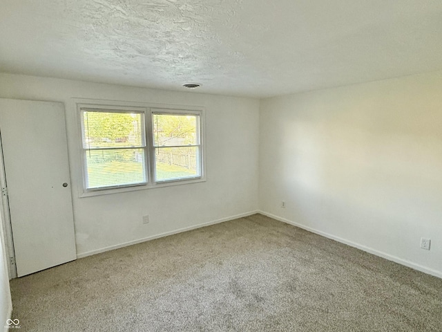 1328 N 300 E, Anderson, IN 46012 - carpeted spare room featuring a textured ceiling and baseboards