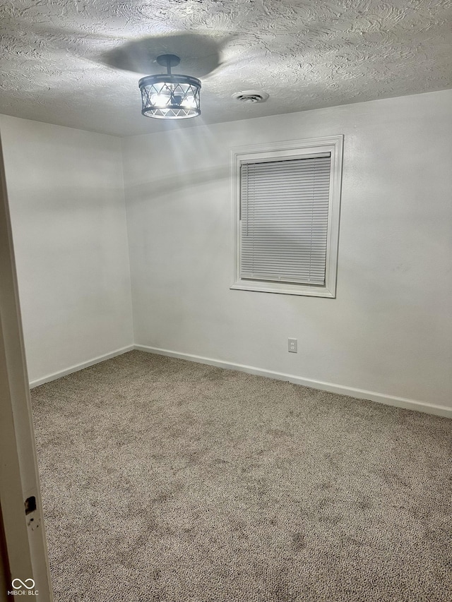1328 N 300 E, Anderson, IN 46012 - carpeted empty room with baseboards and a textured ceiling