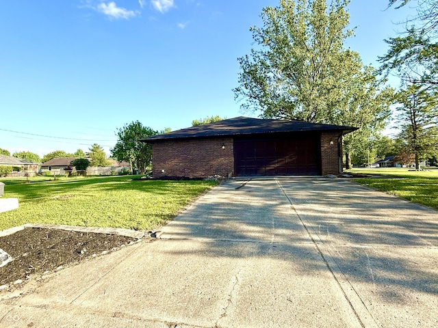 1328 N 300 E, Anderson, IN 46012 - view of home's exterior with brick siding, a yard, driveway, and an outdoor structure
