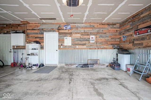 548 Gosford Ct, Westfield, IN 46074 - garage with wooden walls and a garage door opener