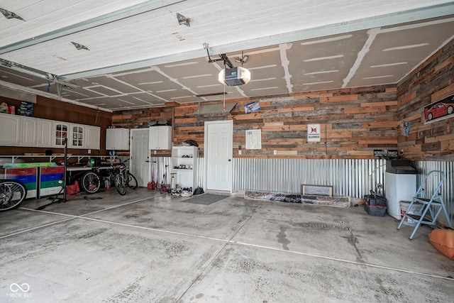 548 Gosford Ct, Westfield, IN 46074 - garage with a garage door opener and wood walls