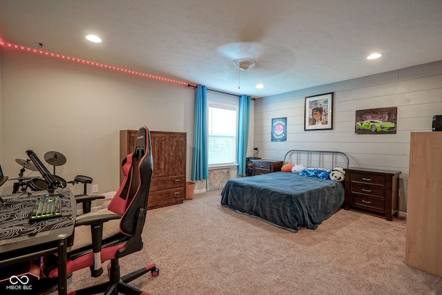 548 Gosford Ct, Westfield, IN 46074 - bedroom with light colored carpet, recessed lighting, a ceiling fan, and wooden walls