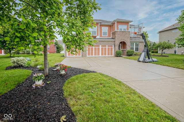 548 Gosford Ct, Westfield, IN 46074 - view of front facade with a garage, concrete driveway, brick siding, and a front lawn