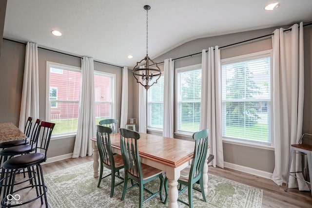548 Gosford Ct, Westfield, IN 46074 - dining space featuring a chandelier, vaulted ceiling, light wood-style floors, and recessed lighting