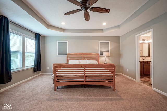 548 Gosford Ct, Westfield, IN 46074 - bedroom with carpet flooring, a raised ceiling, ensuite bathroom, recessed lighting, and a ceiling fan