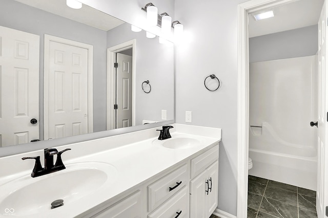 7513 Pine Royal Dr, Indianapolis, IN 46256 - bathroom featuring double vanity, marble look tiles, and tub / shower combination