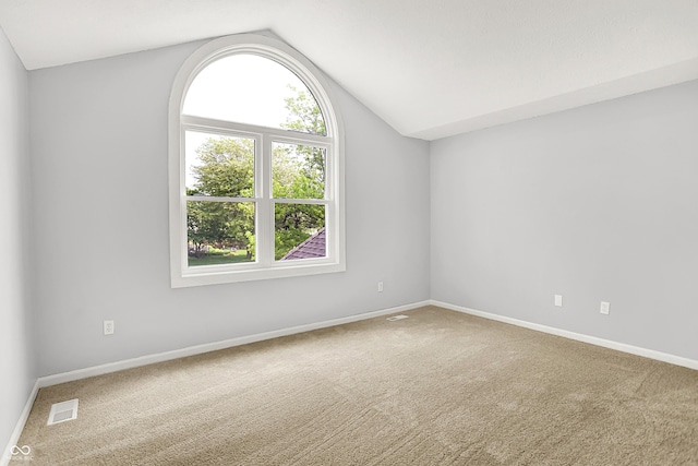 7513 Pine Royal Dr, Indianapolis, IN 46256 - carpeted spare room with vaulted ceiling and baseboards