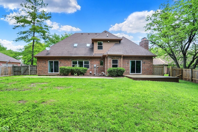 7513 Pine Royal Dr, Indianapolis, IN 46256 - back of house featuring a fenced backyard, a chimney, brick siding, and a shingled roof
