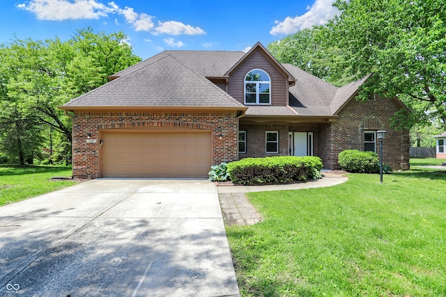 7513 Pine Royal Dr, Indianapolis, IN 46256 - view of front facade featuring brick siding, an attached garage, and a front lawn