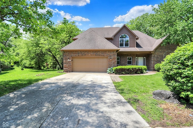 7513 Pine Royal Dr, Indianapolis, IN 46256 - view of front of property featuring an attached garage, brick siding, concrete driveway, a front yard, and roof with shingles