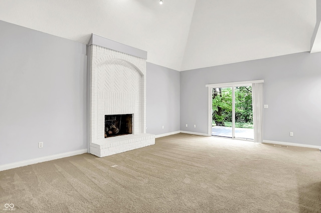 7513 Pine Royal Dr, Indianapolis, IN 46256 - unfurnished living room with high vaulted ceiling, carpet floors, and a fireplace