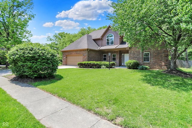 7513 Pine Royal Dr, Indianapolis, IN 46256 - view of front facade with an attached garage, brick siding, and concrete driveway