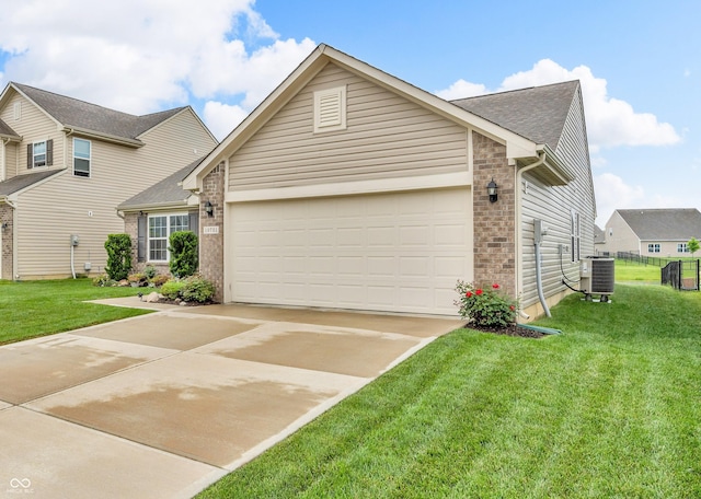10731 Jimmy Lake Dr, Indianapolis, IN 46239 - view of front facade with driveway, an attached garage, brick siding, a front lawn, and central AC unit