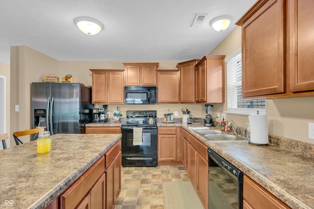10731 Jimmy Lake Dr, Indianapolis, IN 46239 - kitchen with black appliances, a sink, light countertops, and brown cabinets